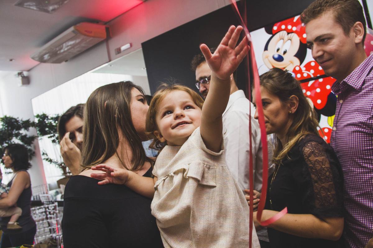 Gabriela laughing during her Minnie Mouse birthday party